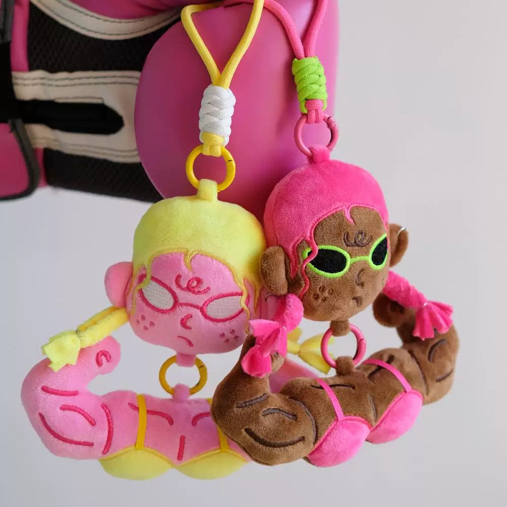 wulibuddy Dark Skin  Baddie plush character bag charm attached to a denim handbag