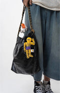 wulibuddy Street Wizard yellow plush muscle character bag charm hanging on a bag